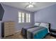 Cozy bedroom with plush carpet, a TV, shutters, and a serene atmosphere for relaxation at 7520 Fontera Ct, Las Vegas, NV 89139