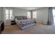 Spacious main bedroom with plush carpeting, plantation shutters, and a sliding glass door at 7520 Fontera Ct, Las Vegas, NV 89139