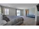Expansive main bedroom featuring a cozy bed, sitting area, and a private outdoor balcony at 7520 Fontera Ct, Las Vegas, NV 89139