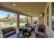 Covered patio area with outdoor seating perfect for entertaining and enjoying the backyard view at 7520 Fontera Ct, Las Vegas, NV 89139