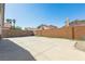 Expansive backyard with a large concrete patio, offering ample space for outdoor activities at 7728 Barbican Ct, Las Vegas, NV 89147