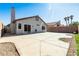Large concrete patio is perfect for outdoor gatherings and relaxation in the expansive backyard at 7728 Barbican Ct, Las Vegas, NV 89147