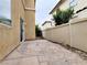 Concrete backyard patio area with rock landscaping and perimeter fence at 7863 Warwickshire Way, Las Vegas, NV 89139