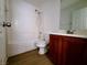 Bathroom featuring a shower-tub combo with a cherry wood vanity at 7863 Warwickshire Way, Las Vegas, NV 89139