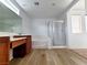 Bright bathroom featuring a soaking tub, walk-in shower, and vanity with sink at 7863 Warwickshire Way, Las Vegas, NV 89139