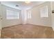 Light and bright bedroom featuring neutral colored walls and carpet with multiple windows at 7863 Warwickshire Way, Las Vegas, NV 89139