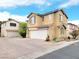 Inviting two-story home featuring a spacious driveway and attached two-car garage at 7863 Warwickshire Way, Las Vegas, NV 89139