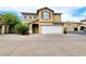 Inviting two-story home with a well-maintained front yard and two-car garage at 7863 Warwickshire Way, Las Vegas, NV 89139