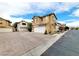 Inviting two-story home showcasing a two-car garage, shuttered windows, and well-maintained landscaping at 7863 Warwickshire Way, Las Vegas, NV 89139