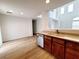 The kitchen features wood floors, stainless steel appliances, and warm lighting at 7863 Warwickshire Way, Las Vegas, NV 89139
