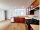 Modern kitchen features stainless steel appliances, wood cabinets, and an open layout at 7863 Warwickshire Way, Las Vegas, NV 89139