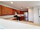 Updated kitchen boasts stainless steel appliances and wood cabinets at 7863 Warwickshire Way, Las Vegas, NV 89139