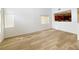 Bright, open living room with hardwood floors and a kitchen view at 7863 Warwickshire Way, Las Vegas, NV 89139