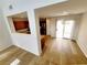 Bright living room area with wood flooring and glass sliding door to the backyard at 7863 Warwickshire Way, Las Vegas, NV 89139