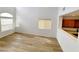 Open-concept living room with hardwood floors and a view into the kitchen at 7863 Warwickshire Way, Las Vegas, NV 89139