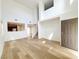 Bright living room boasts hardwood floors and abundant natural light at 7863 Warwickshire Way, Las Vegas, NV 89139