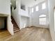 Spacious living room features high ceilings, hardwood floors, and a staircase at 7863 Warwickshire Way, Las Vegas, NV 89139