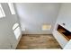 Bright, airy living room with hardwood floors and a view into the kitchen at 7863 Warwickshire Way, Las Vegas, NV 89139
