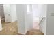 Staircase leading to the upper level with carpeted steps and a white railing at 7863 Warwickshire Way, Las Vegas, NV 89139