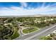 A birds eye view of a Primary-planned community featuring lush landscaping, mature trees, and tree-lined streets at 7988 Harbour Towne Ave, Las Vegas, NV 89113