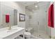 Modern bathroom with a glass-enclosed shower, vanity, and stylish fixtures at 7988 Harbour Towne Ave, Las Vegas, NV 89113