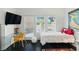 Bright bedroom featuring a desk, seating, and patio access at 7988 Harbour Towne Ave, Las Vegas, NV 89113