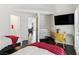 Comfortable bedroom offering two twin beds, a built-in shelving unit, and a TV at 7988 Harbour Towne Ave, Las Vegas, NV 89113