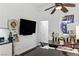 Eat-in kitchen and dining area with dark wood floors, vaulted ceiling, and a ceiling fan at 7988 Harbour Towne Ave, Las Vegas, NV 89113