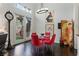 Dining area features dark wood floors, stylish light fixture, and access to the backyard at 7988 Harbour Towne Ave, Las Vegas, NV 89113