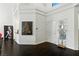 Bright entryway with dark wood floors, high ceilings and a decorative mirror at 7988 Harbour Towne Ave, Las Vegas, NV 89113
