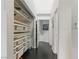 Hallway features a custom storage system with shelving, and dark wood floors at 7988 Harbour Towne Ave, Las Vegas, NV 89113