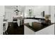 Bright kitchen with white cabinets, stainless steel appliances, and a ceiling fan at 7988 Harbour Towne Ave, Las Vegas, NV 89113