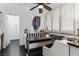 Bright breakfast nook with white shutters, a ceiling fan, and hardwood floors at 7988 Harbour Towne Ave, Las Vegas, NV 89113