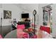 Bright living room with vaulted ceilings, dark wood floors, and a modern fireplace at 7988 Harbour Towne Ave, Las Vegas, NV 89113