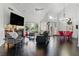 Bright living room features hardwood floors, a fireplace, and stylish decor at 7988 Harbour Towne Ave, Las Vegas, NV 89113