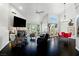 Open living room with modern furnishings, vaulted ceilings, and a fireplace at 7988 Harbour Towne Ave, Las Vegas, NV 89113
