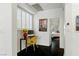 Office area with a desk, window with shutters, and view into the bedroom at 7988 Harbour Towne Ave, Las Vegas, NV 89113
