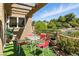Relaxing covered patio area with outdoor seating and views of the manicured landscaping at 7988 Harbour Towne Ave, Las Vegas, NV 89113