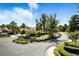 An attractive subdivision entrance with a landscaped median in a golf course community evokes a sense of upscale living at 7988 Harbour Towne Ave, Las Vegas, NV 89113