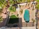 Backyard aerial view showcases a rock pool, grassy area, mature landscaping, and a storage shed at 8320 Deer Springs Way, Las Vegas, NV 89149