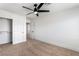 Bright bedroom features neutral carpet, a modern ceiling fan, and a closet at 8320 Deer Springs Way, Las Vegas, NV 89149