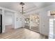 Dining area with sliding glass doors to the backyard, built-in cabinets, and a modern chandelier at 8320 Deer Springs Way, Las Vegas, NV 89149