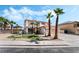 Charming two-story home with desert landscaping and mature palm trees at 8320 Deer Springs Way, Las Vegas, NV 89149