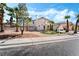 Charming two-story home with desert landscaping and lush green accents at 8320 Deer Springs Way, Las Vegas, NV 89149