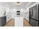 Stylish kitchen with white cabinets, quartz countertops, and stainless steel appliances for modern appeal at 8320 Deer Springs Way, Las Vegas, NV 89149