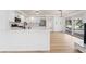 Modern kitchen with white cabinets, stainless steel appliances, and a large island perfect for entertaining at 8320 Deer Springs Way, Las Vegas, NV 89149