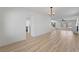 Bright living room with wood-look floors, modern lighting, and neutral walls for versatile decor options at 8320 Deer Springs Way, Las Vegas, NV 89149