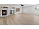 Spacious living room featuring wood floors and a fireplace at 8320 Deer Springs Way, Las Vegas, NV 89149