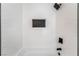 Updated shower features sleek tile, a rainfall shower head, and built-in niche at 8320 Deer Springs Way, Las Vegas, NV 89149