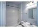Bright bathroom featuring single sink vanity, tub with shower and updated light fixture at 8555 W Russell Rd # 2020, Las Vegas, NV 89113